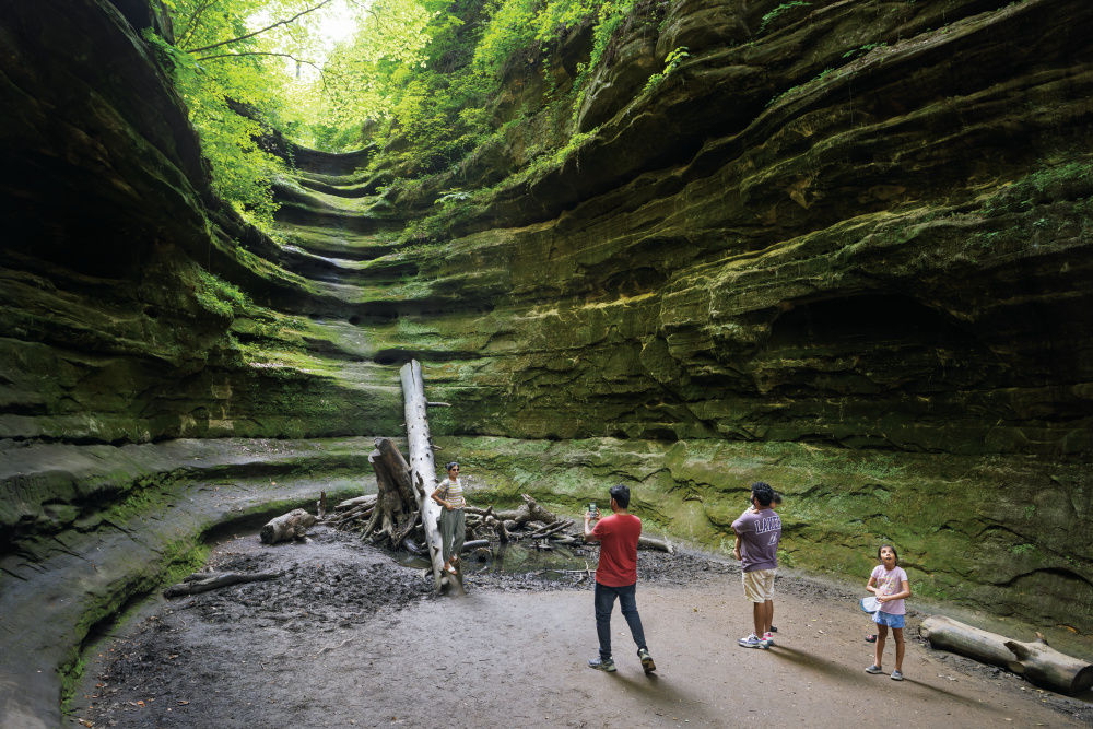 Visitors hiking in Starved Rock State Park, one of the reasons to visit LaSalle County