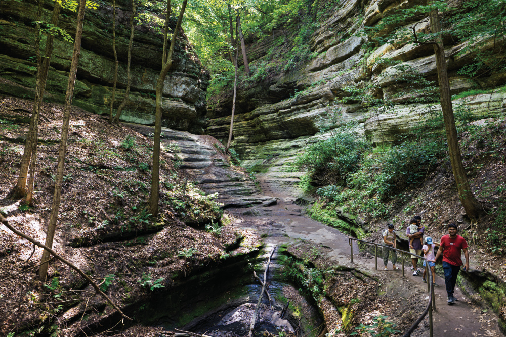 Visitors explore French Canyon at Starved Rock State Park in North Utica, one of the reasons to visit LaSalle County