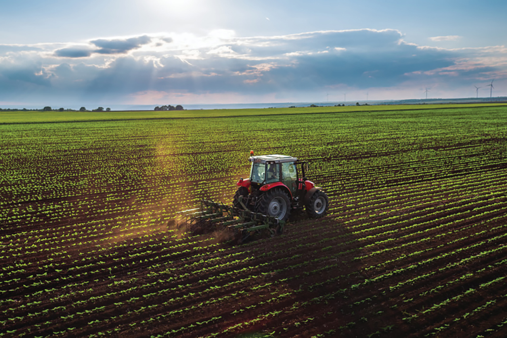 Tractor cultivating a field