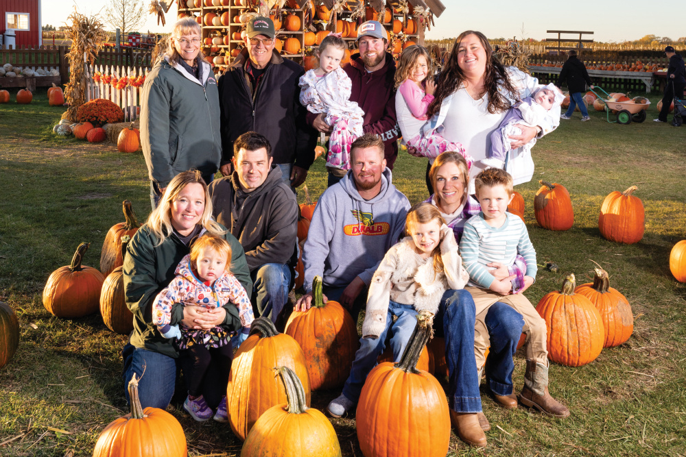 Members of the Stade family pose for a photo amongst the pumpkins at Stade’s Farm & Market