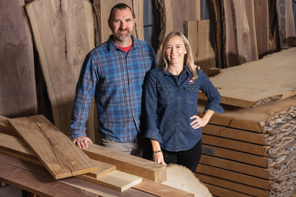 Nick and Angie DeVolder standing among wood options at Stella Sawmill