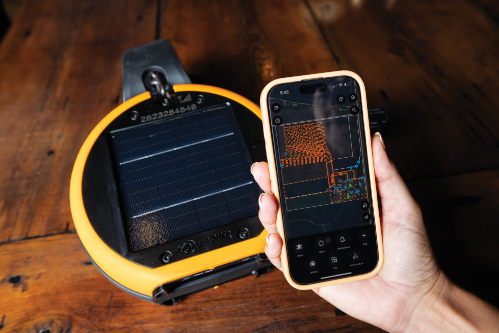 Up-close of one of the electronic collars the cattle wear and also the mobile app where the Sandersons manage electronic boundaries