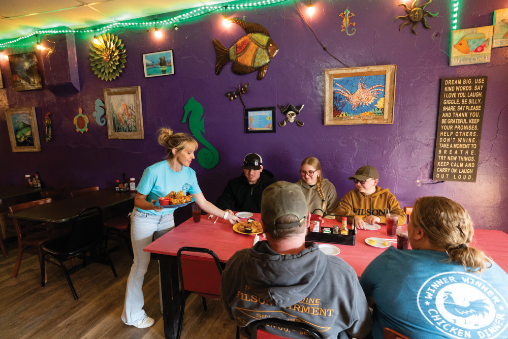 Rebecca Jeffords servers customers at The Diver Down