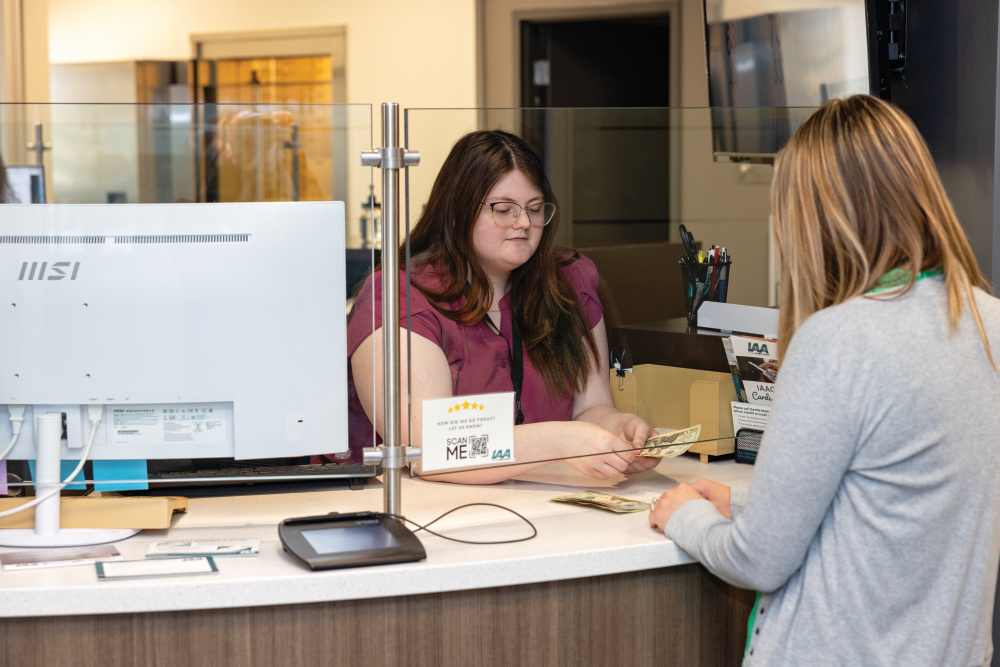 Teller assists a customer at IAA Credit Union